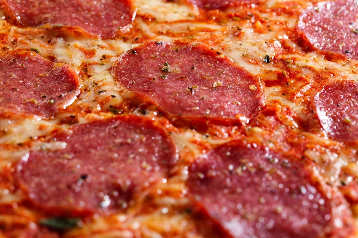 Detailed view of Sopressata slices, exploring the distinction from pepperoni.