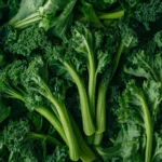 Fresh rapini bunch on a rustic wooden table.